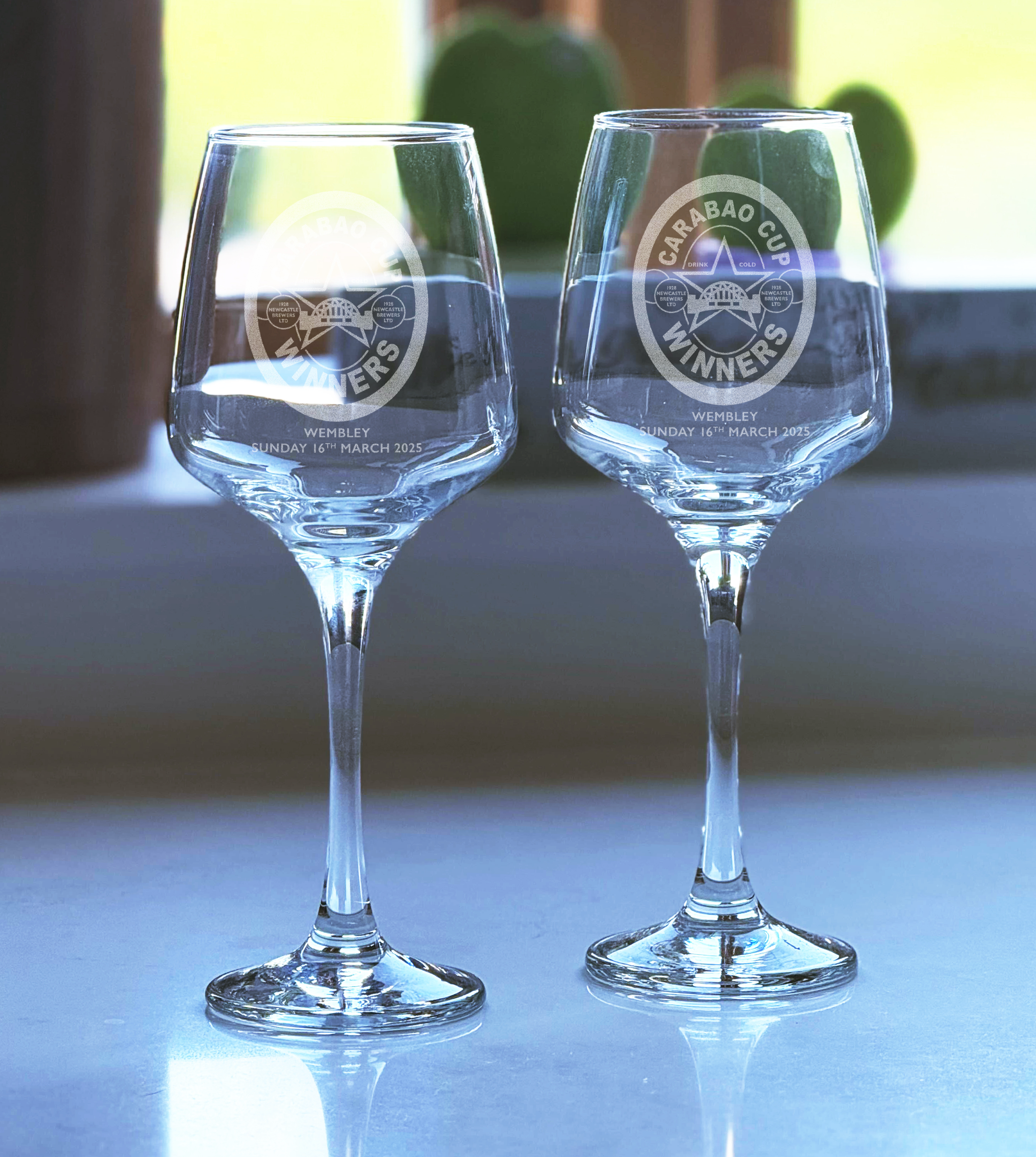 Two Newcastle United Carabao Cup Winners engraved wine glasses with Wembley 2025 design, celebrating NUFC victory.